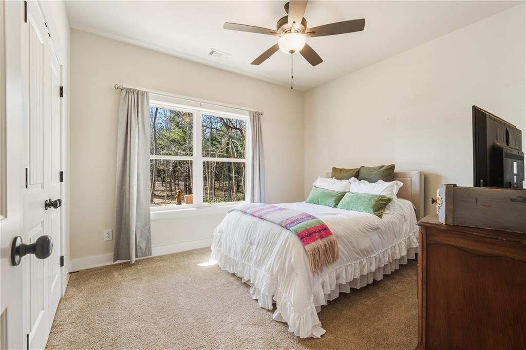 3462 Vinson Mountain Road Rockmart, GA 30153 - Photo 21 of 31 a bed room with a bed and a tv