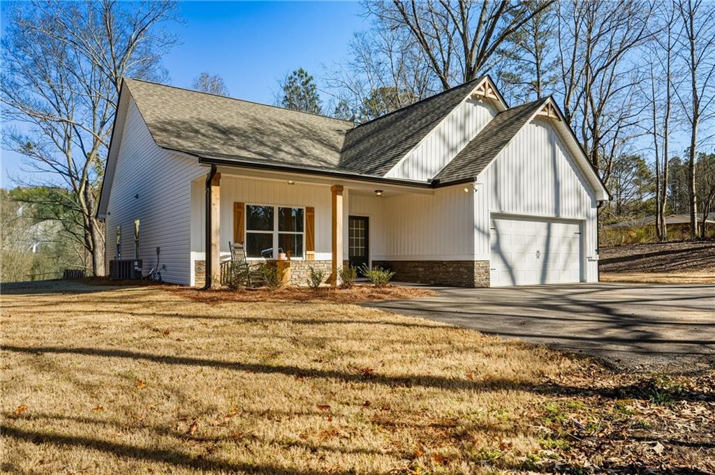 3462 Vinson Mountain Road Rockmart, GA 30153 - Photo 29 of 31 a view of a house with a patio