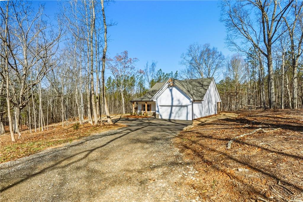 3462 Vinson Mountain Road Rockmart, GA 30153 - Photo 30 of 31 a view of a house with snow on the road
