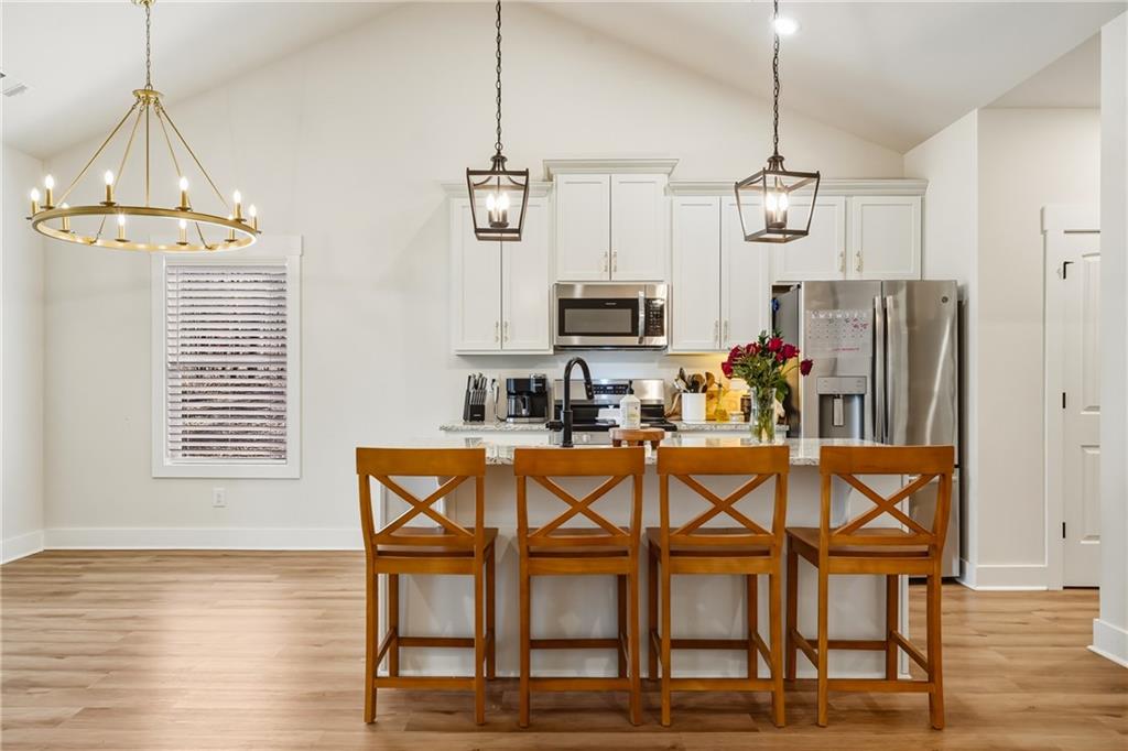 3462 Vinson Mountain Road Rockmart, GA 30153 - Photo 9 of 31 a view of a dining room with furniture window and wooden floor