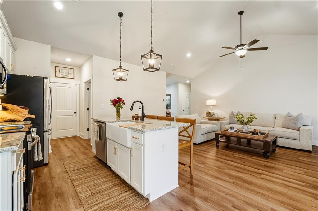 3462 Vinson Mountain Road Rockmart, GA 30153 - Photo 10 of 31 a open kitchen with sink stove and wooden floor