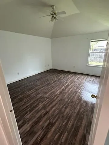 a bathroom with a sink a toilet a mirror and shower
