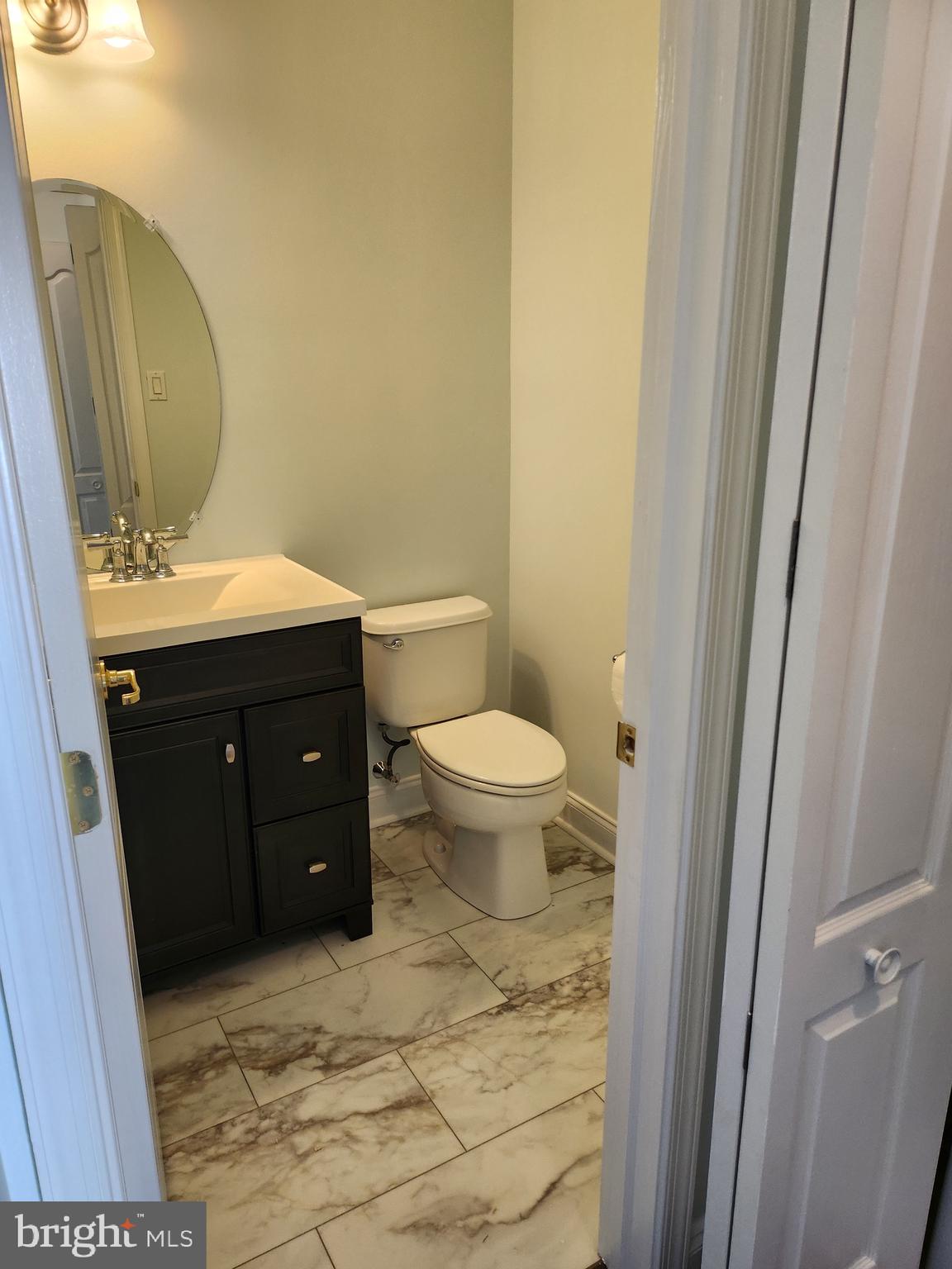 161 Stoyer Road Coatesville, PA 19320 - Photo 5 of 17 a bathroom with a granite countertop toilet and sink