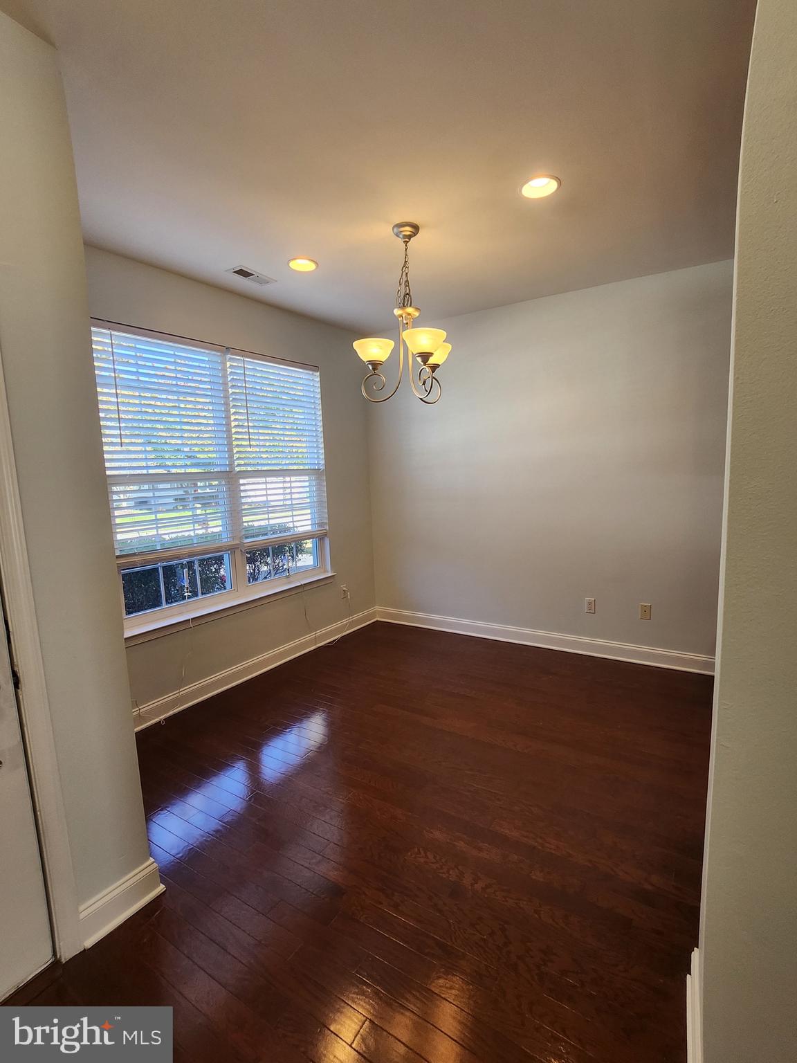 161 Stoyer Road Coatesville, PA 19320 - Photo 7 of 17 a view of an empty room with window and wooden floor