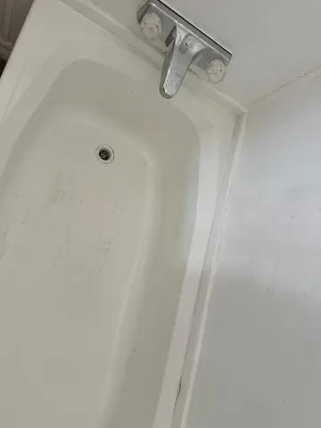 a close view of a shower in bathroom