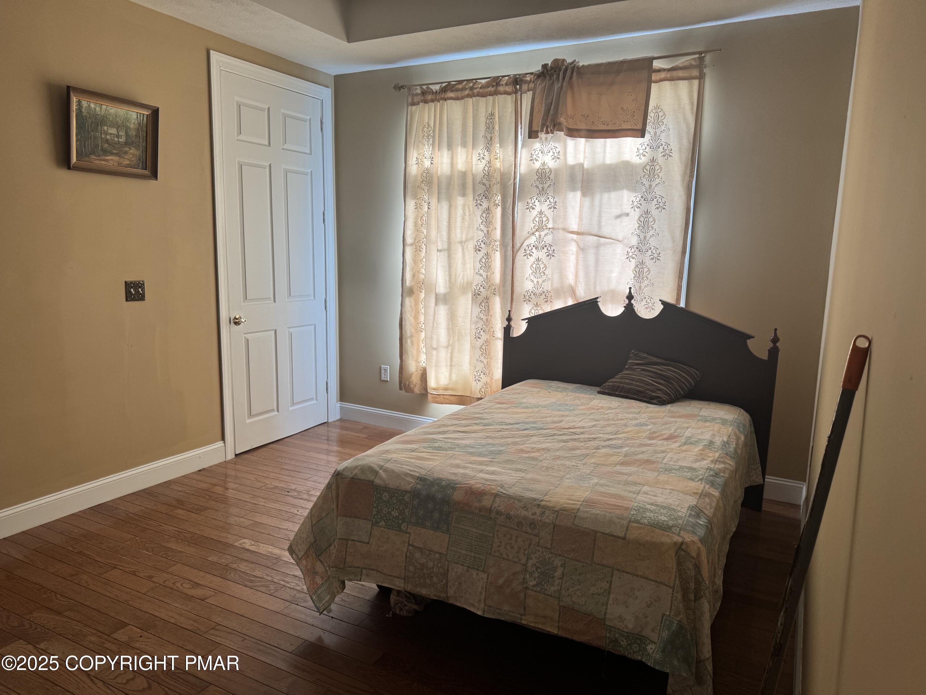 369 Bossardsville Road Stroudsburg, PA 18360 - Photo 12 of 17 a bedroom with a bed and a window
