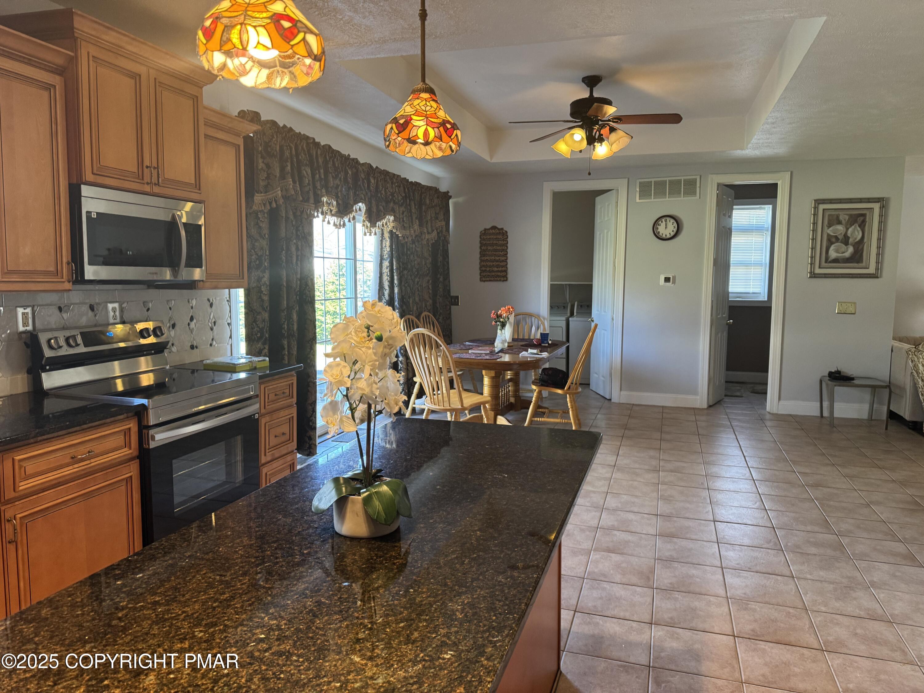 369 Bossardsville Road Stroudsburg, PA 18360 - Photo 2 of 17 a living room with furniture and a flat screen tv