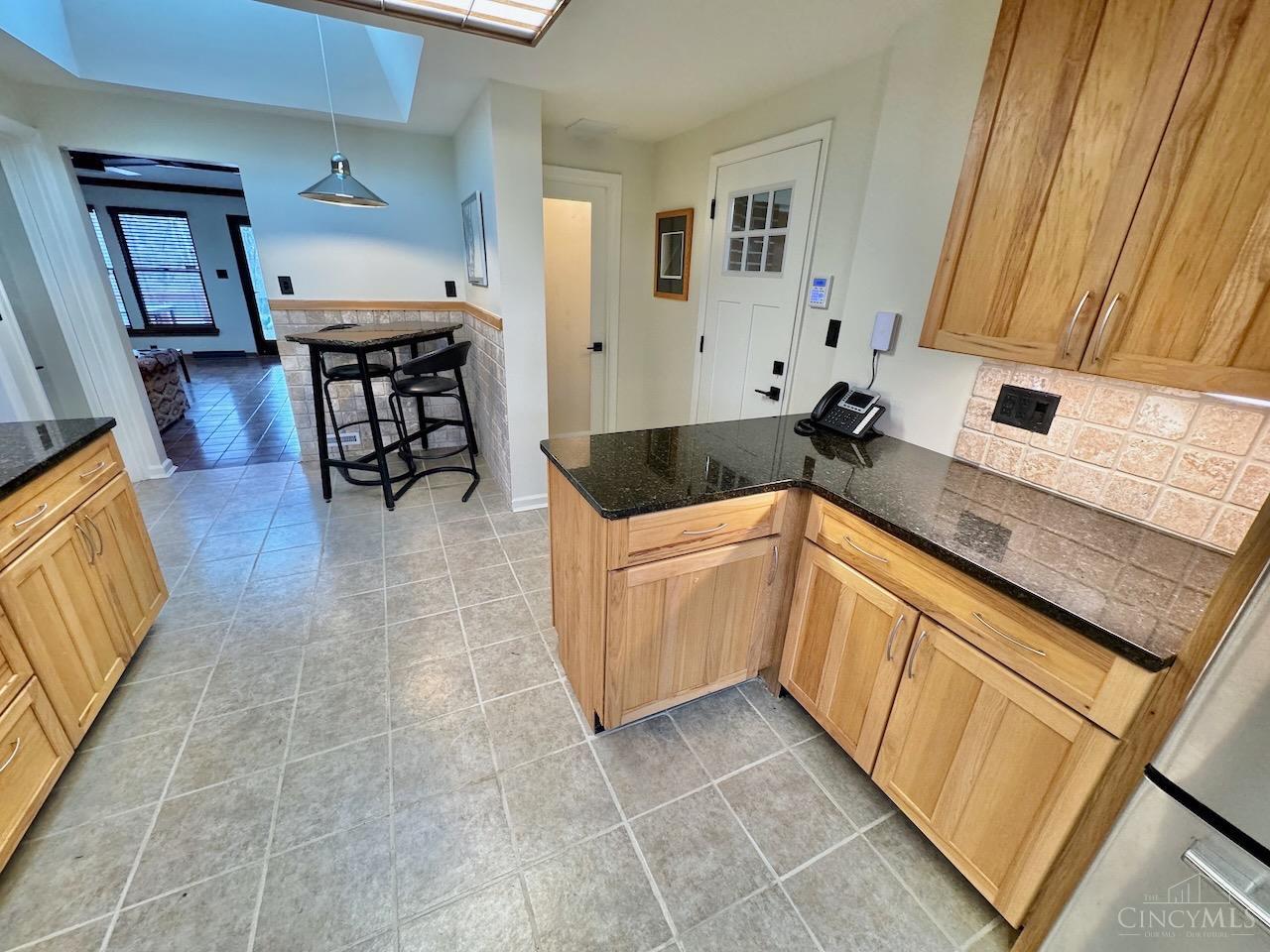 7877 State Road Cincinnati, OH 45255 - Photo 17 of 54 Kitchen looking into the breakfast nook and half bath to the right