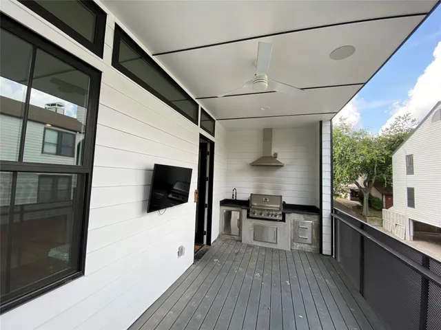 a bathroom with a double vanity sink a mirror and a bathtub