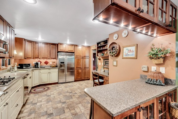 67 Chester Road Boxborough, MA 01719 - Photo 12 of 28 a kitchen with granite countertop a stove a sink dishwasher and a refrigerator with wooden floor