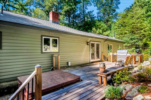 67 Chester Road Boxborough, MA 01719 - Photo 25 of 28 a backyard of a house with seating space