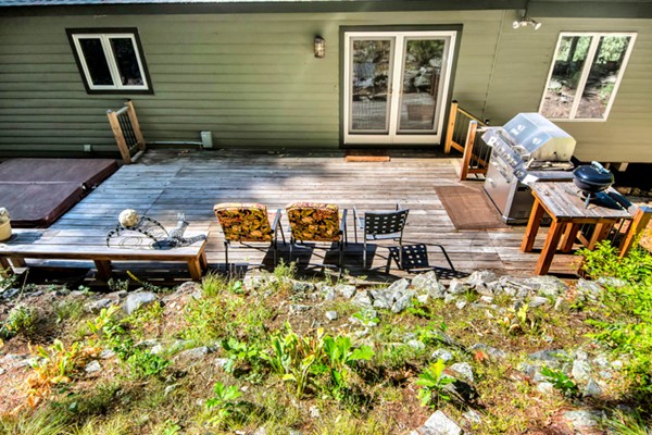 67 Chester Road Boxborough, MA 01719 - Photo 27 of 28 a backyard of a house with seating space