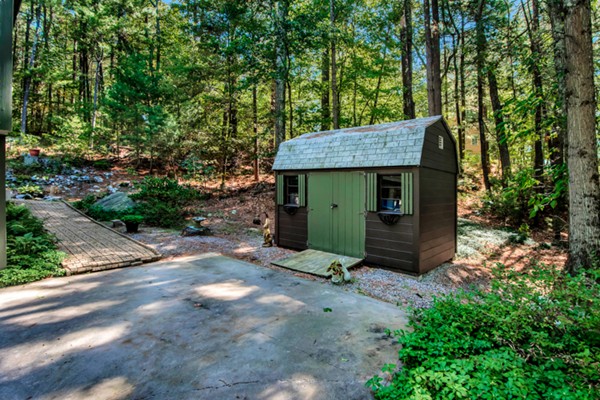 67 Chester Road Boxborough, MA 01719 - Photo 28 of 28 a view of a backyard with a tree