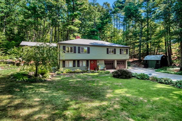 67 Chester Road Boxborough, MA 01719 - Photo 3 of 28 a view of a house with a big yard potted plants and large tree