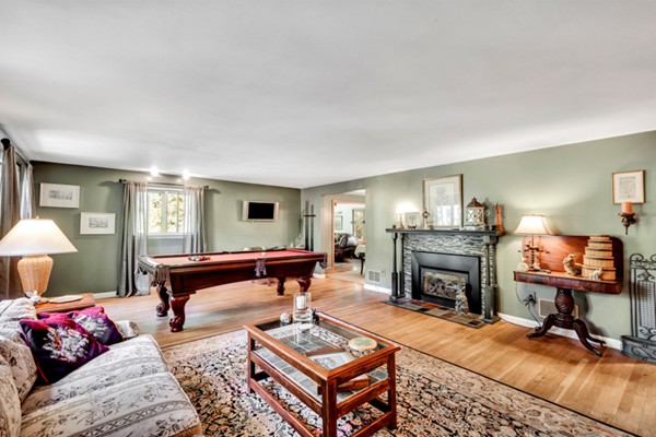 67 Chester Road Boxborough, MA 01719 - Photo 7 of 28 a living room with furniture a fireplace and a table