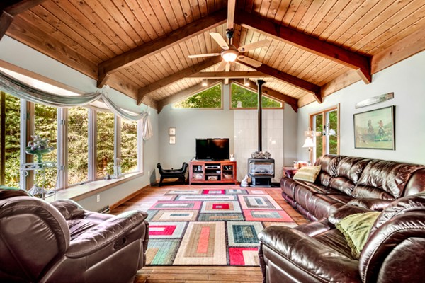 67 Chester Road Boxborough, MA 01719 - Photo 9 of 28 a living room with furniture a flat screen tv and a large window