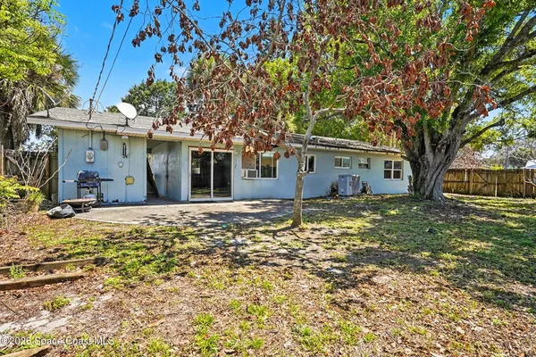 a view of a house with a tree
