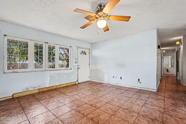 a view of an empty room with a window