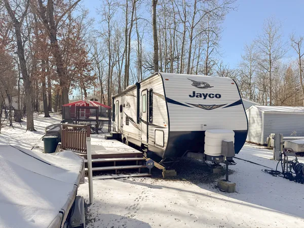 a view of a chairs and tables in the back yard of the house