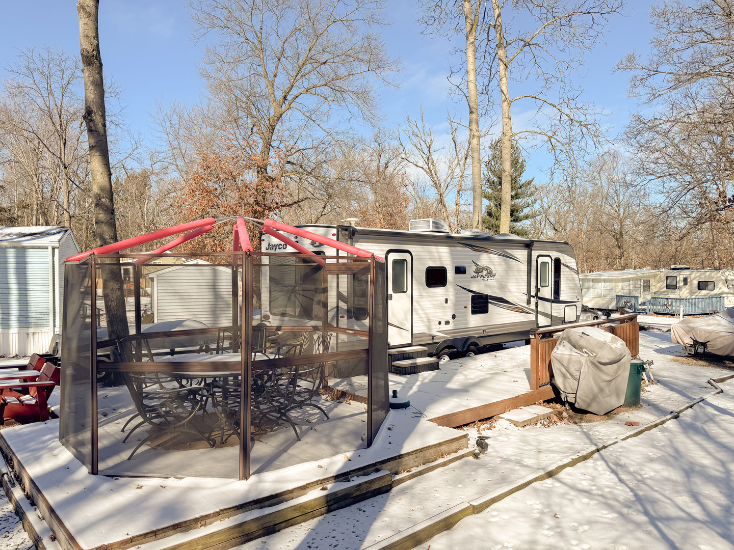 5-356 Woodhaven Sublette, IL 61367 - Photo 4 of 14 a yellow house with trees in front of it