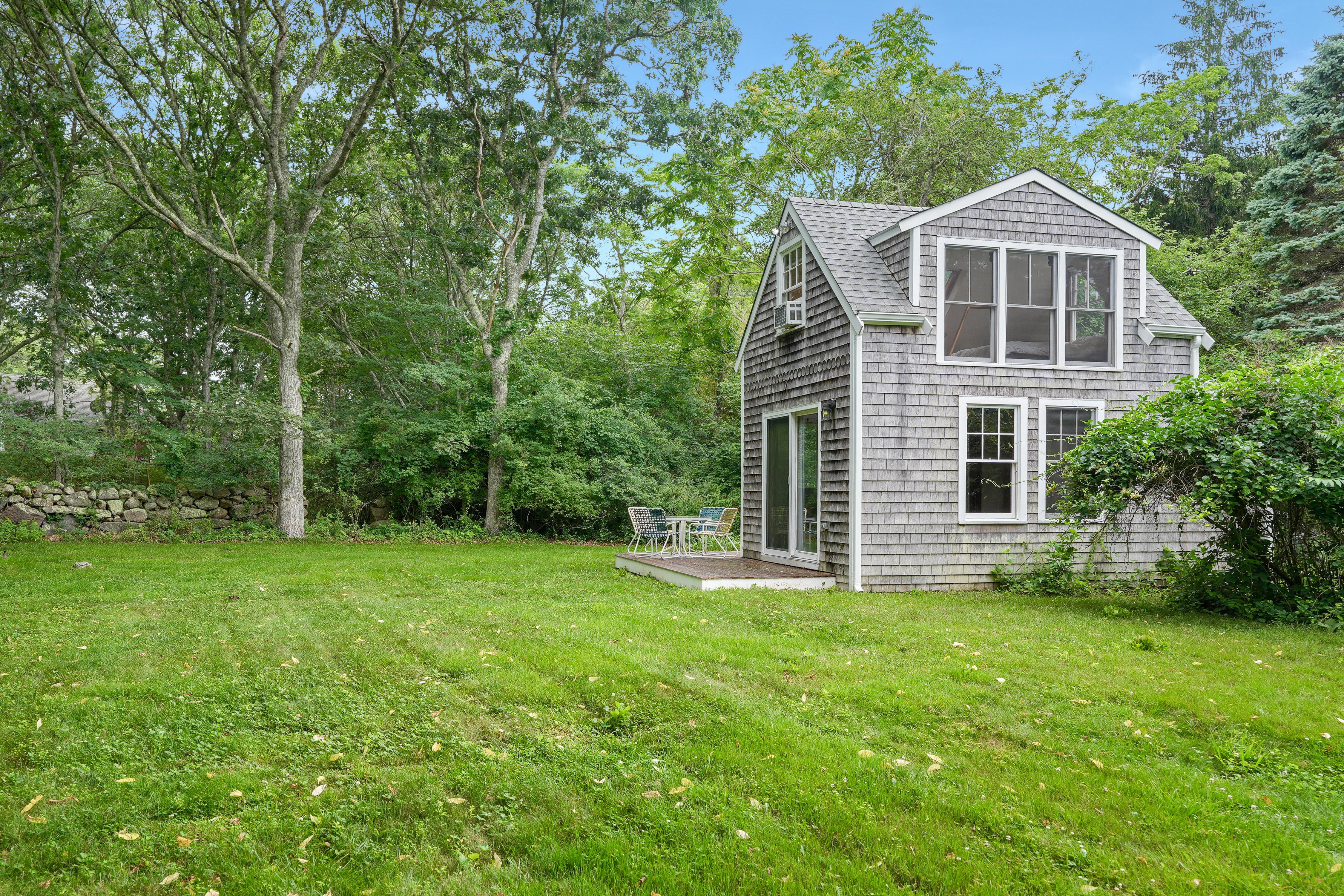 174 Middle Road Chilmark, MA 02535 - Photo 30 of 40 a front view of a house with a yard