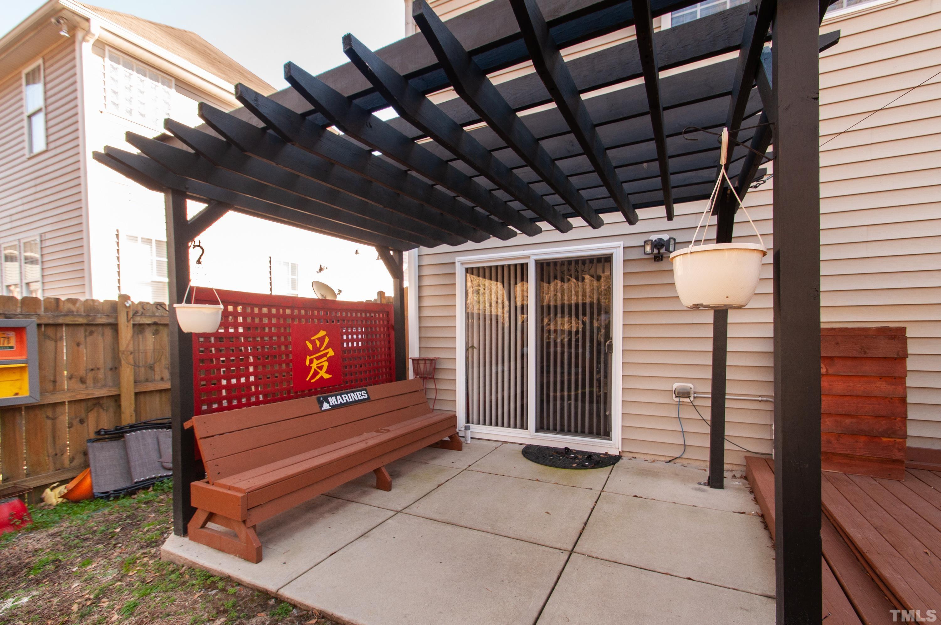 3921 Joe And Ruth Lee Drive Raleigh, NC 27610 - Photo 8 of 36 a view of a bench in patio with a wooden fence