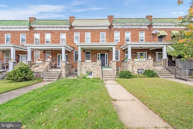 front view of a house with a yard