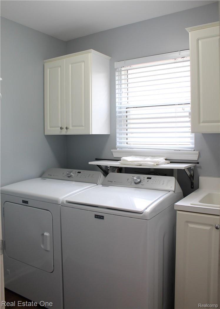 1164 Churchill Circle Rochester, MI 48307 - Photo 15 of 22 20.JPG Laundry Room with mop sink and storage cabinets
