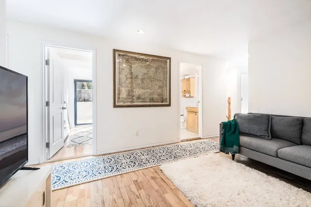 a living room with furniture and a rug