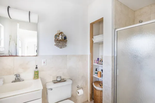 a bathroom with a sink toilet and vanity