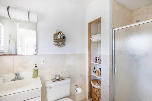 a bathroom with a sink toilet and vanity