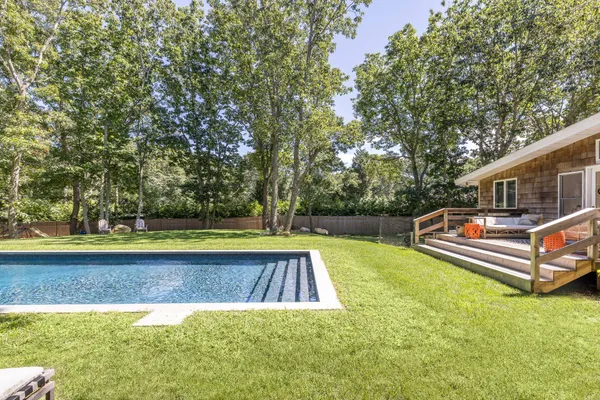 a view of swimming pool with a yard