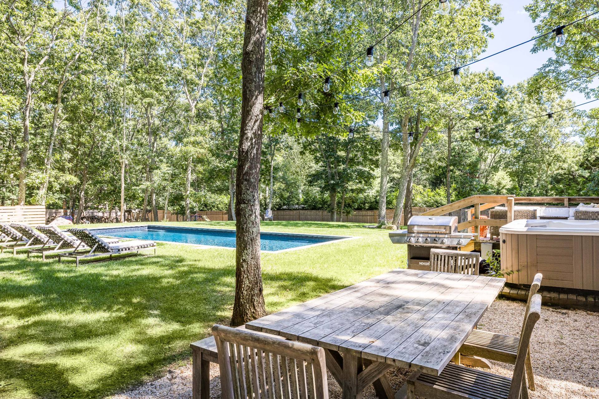 82 Springy Banks Road East Hampton, NY 11937 - Photo 18 of 21 a view of a swimming pool with a patio