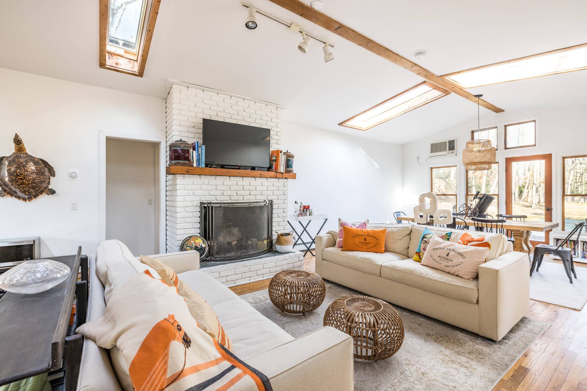 82 Springy Banks Road East Hampton, NY 11937 - Photo 3 of 21 a living room with furniture fireplace and a flat screen tv