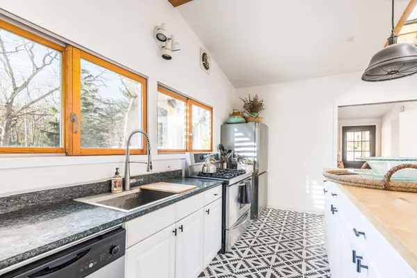 a kitchen with a sink and a window