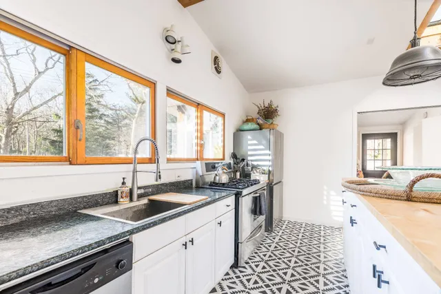 a kitchen with a sink and a window