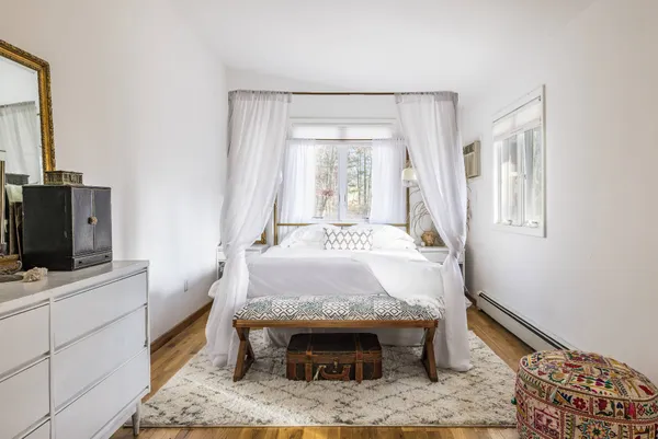 a room with a bed and a fireplace