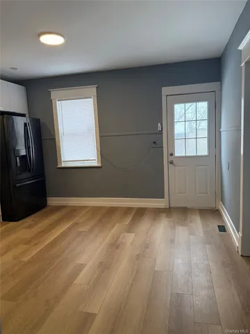 a kitchen with a refrigerator and a stove
