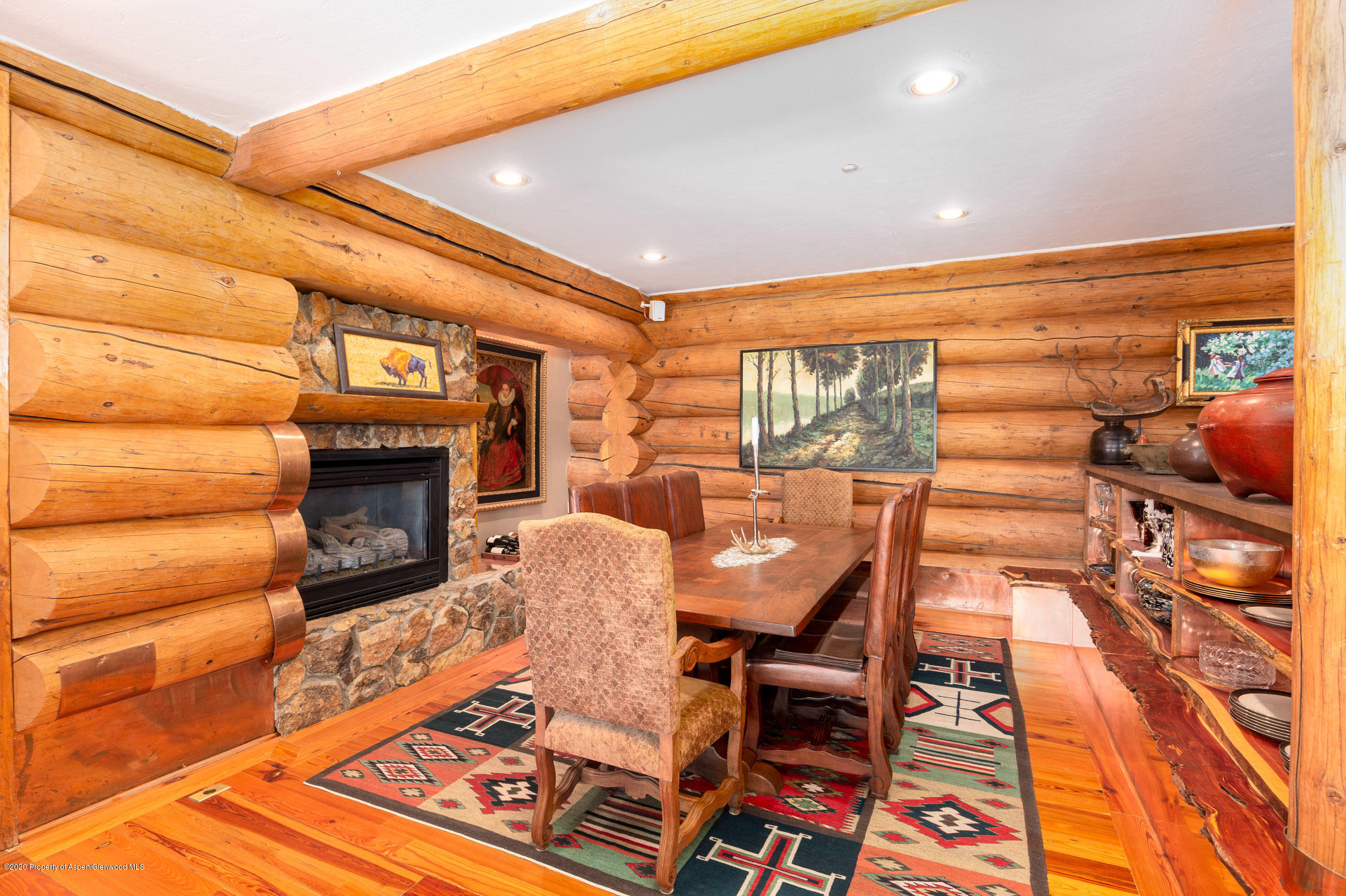2000 Stone Road Basalt, CO 81621 - Photo 11 of 47 a dining room with furniture and a fireplace