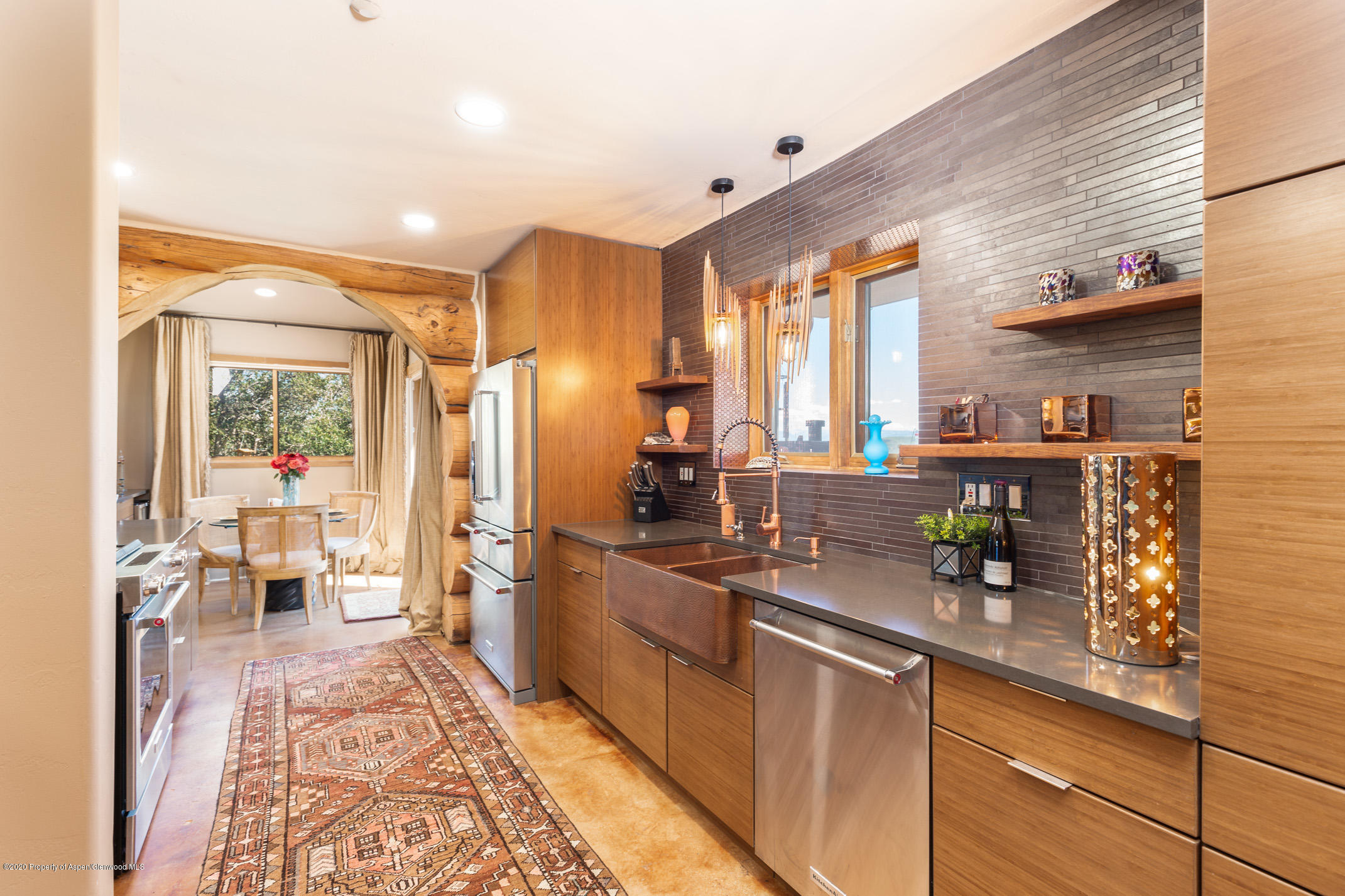 2000 Stone Road Basalt, CO 81621 - Photo 15 of 47 a kitchen with stainless steel appliances a sink a stove and refrigerator