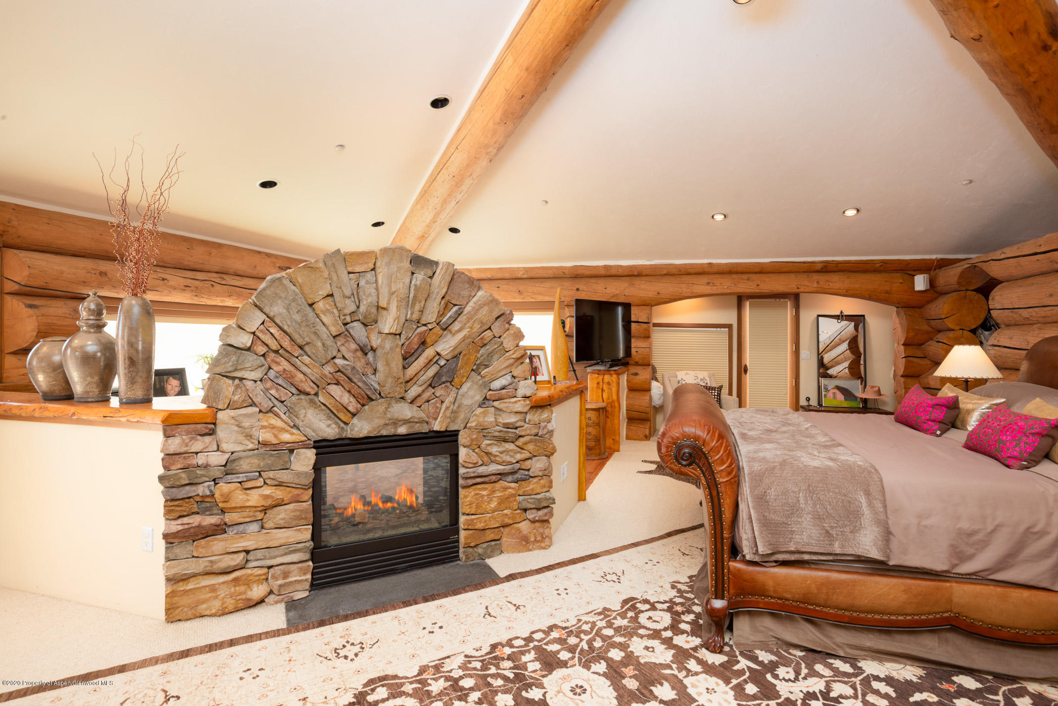 2000 Stone Road Basalt, CO 81621 - Photo 18 of 47 a bed room with a bed and a fireplace