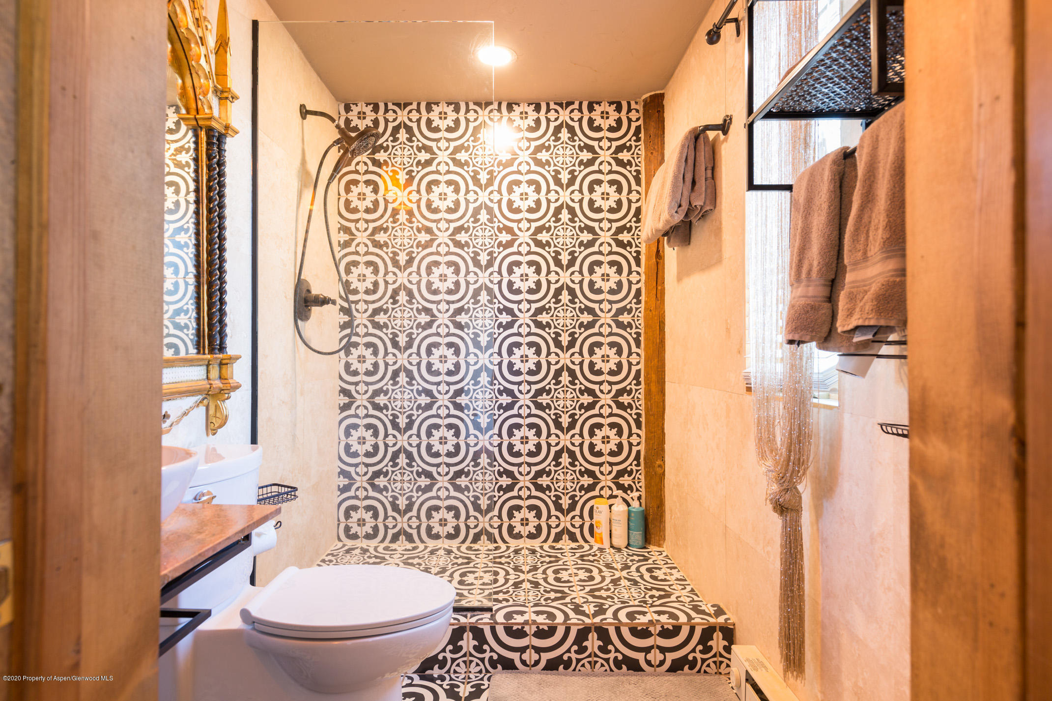 2000 Stone Road Basalt, CO 81621 - Photo 26 of 47 a white toilet sitting next to a shower curtain