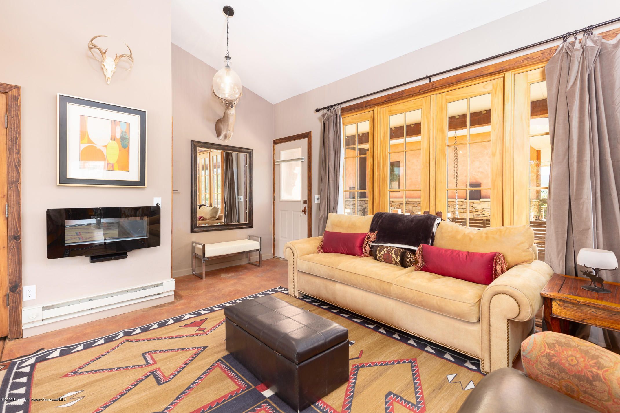 2000 Stone Road Basalt, CO 81621 - Photo 27 of 47 a living room with furniture and a flat screen tv