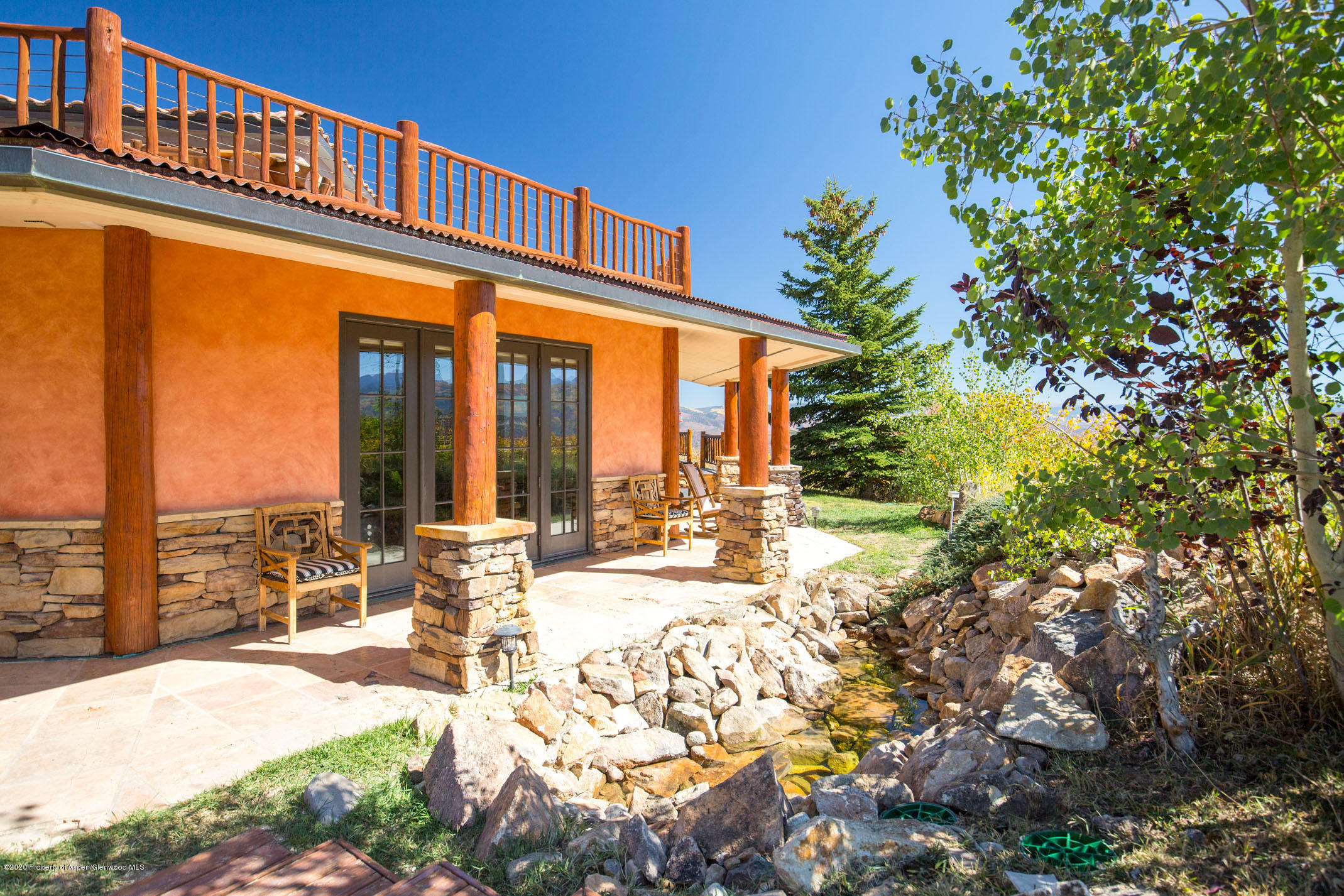 2000 Stone Road Basalt, CO 81621 - Photo 30 of 47 a view of a swimming pool with outdoor seating and a floor to ceiling window