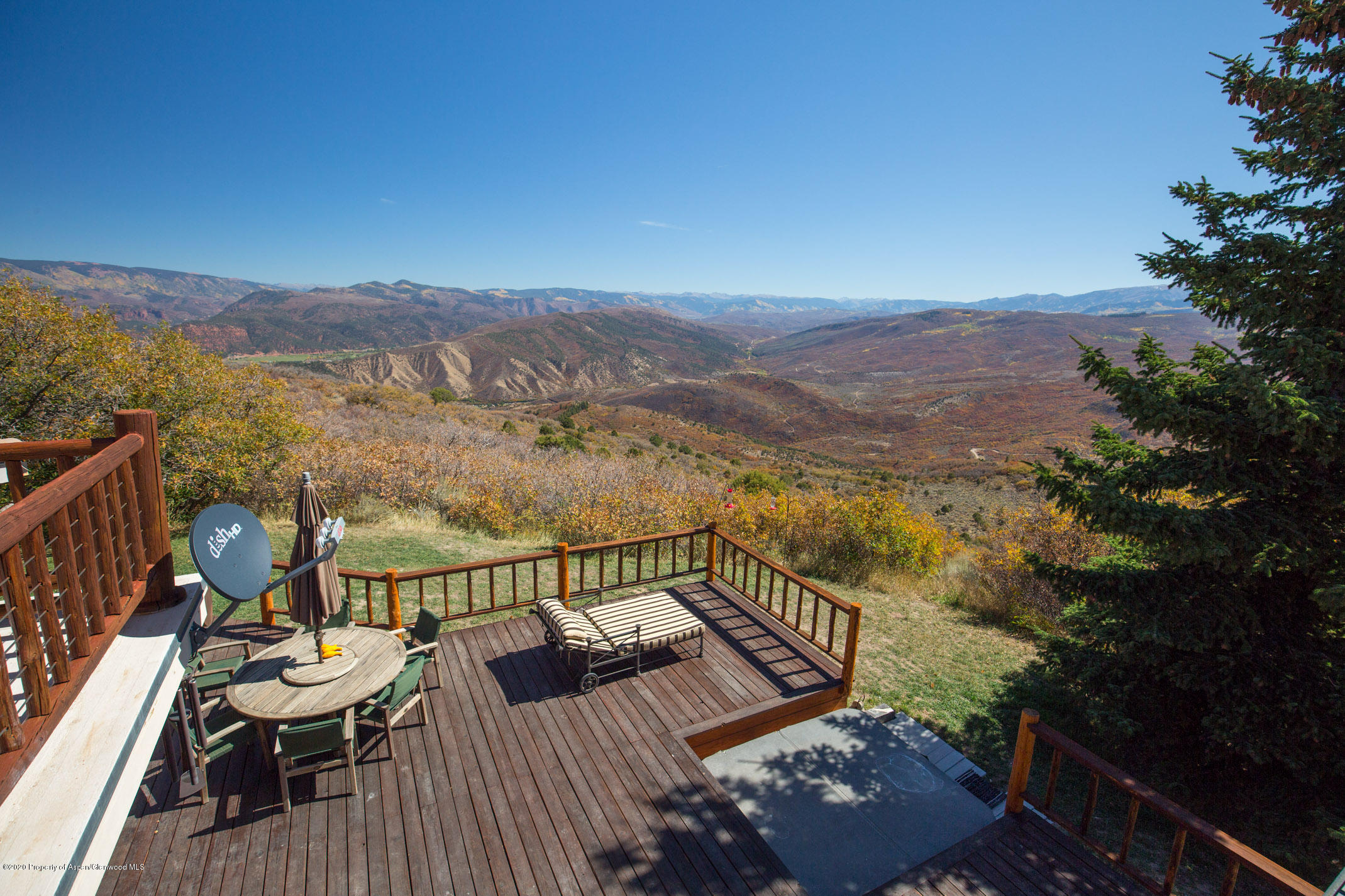 2000 Stone Road Basalt, CO 81621 - Photo 42 of 47 a view of a balcony with wooden floor and a floor to ceiling window