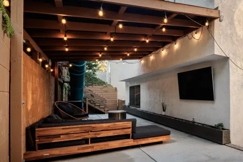 a living room with furniture flat screen tv and a fireplace