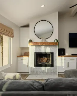 a living room with furniture a fireplace and a flat screen tv