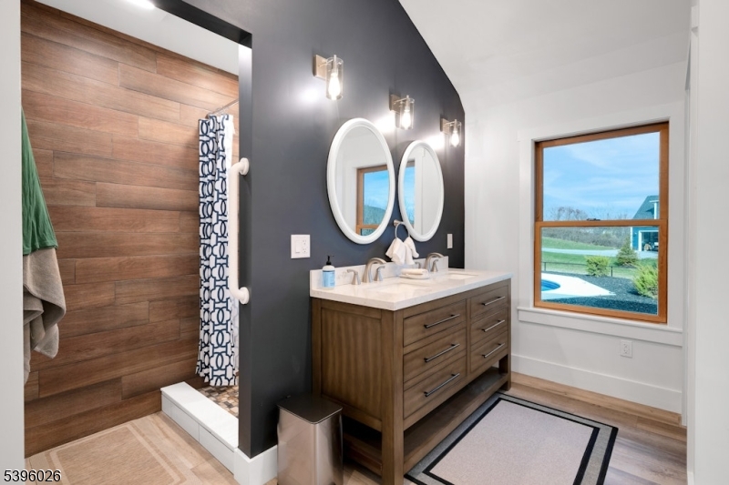 4435 Rudetown Road Hamburg, NJ 07419 - Photo 18 of 24 a bathroom with a sink a mirror a toilet and a shower