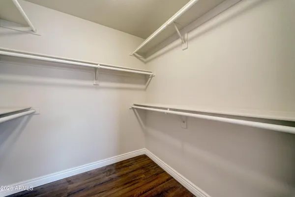 a view of an empty walk in closet
