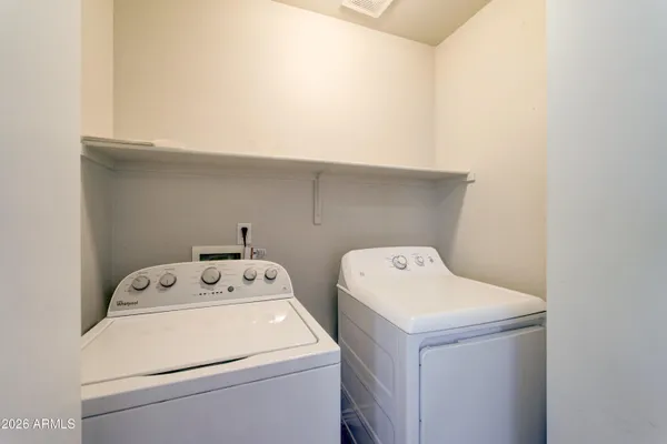 a utility room with dryer and washer